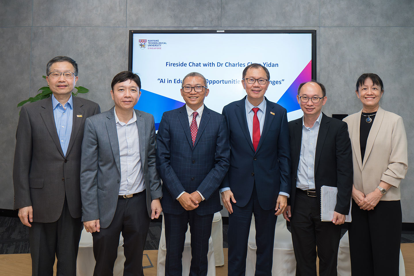 Photo of NTU President, Prof Ho Teck Hua together with the panellists of Fireside Chat on AI and Education.