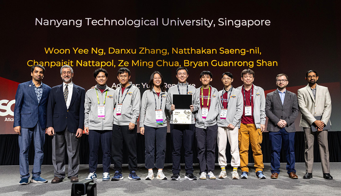 Photo of team NTU receiving award at SC24.