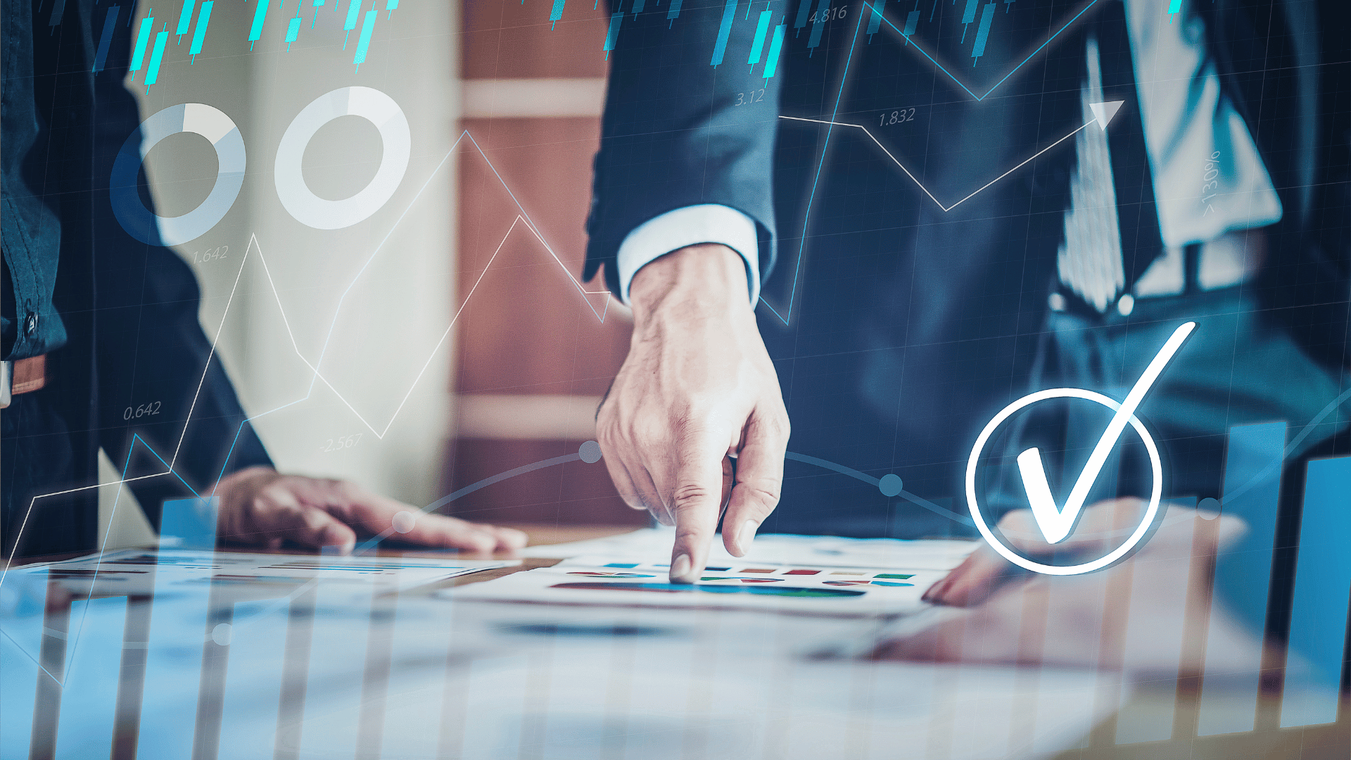 Businessman pointing to a paper with financial charts graphics in the foreground