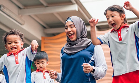 Sparkletots Malay Female Teacher in Grey Tudung Jumping Having Fun Kindergarten Children Closeup (720x432px)
