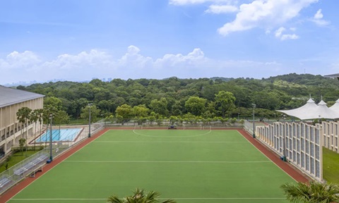 Wideshot Of The Blue Sky and NIE Campus Hockey Pitch Field (720x432px)